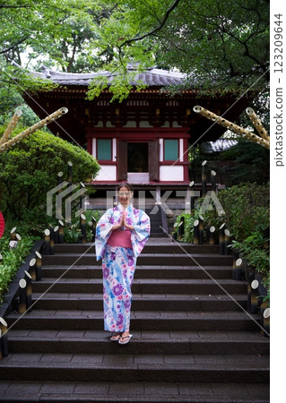 Woman in Kimono Practicing Mindfulness at Japanese Temple  123209644