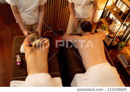 Caucasian couple customer enjoying relaxing anti-stress massage. Quiescent 123209695