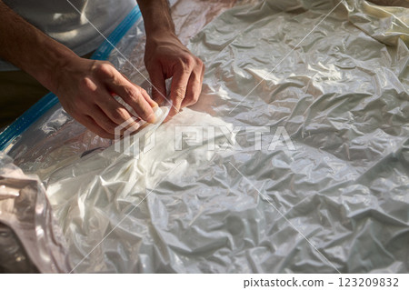 Vacuum Sealing Clothes Effectively for Storage, Preservation, and Space Saving Solutions Vacuum Sealing Clothes Effectively for Storage, Preservation, and Space Saving Solutions 123209832