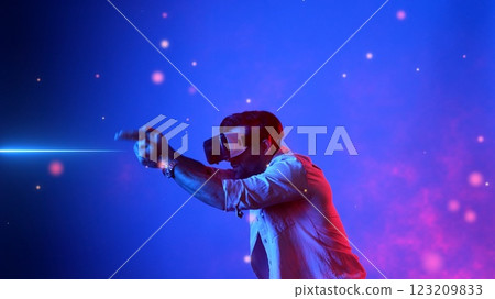 Gamer access metaverse by using VR glasses and playing shooting game. Apparatus. Gamer access metaverse by using VR glasses and playing shooting game. Apparatus. 123209833