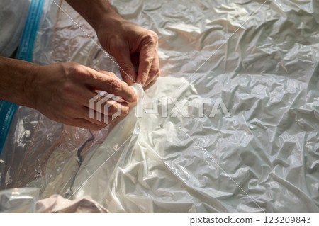Vacuum Sealing Clothes Effectively for Storage, Preservation, and Space Saving Solutions Vacuum Sealing Clothes Effectively for Storage, Preservation, and Space Saving Solutions 123209843