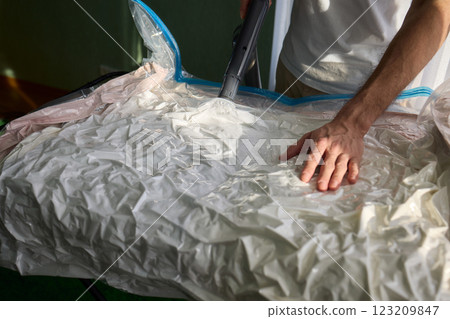 Vacuum Sealing Clothes Effectively for Storage, Preservation, and Space Saving Solutions Vacuum Sealing Clothes Effectively for Storage, Preservation, and Space Saving Solutions 123209847