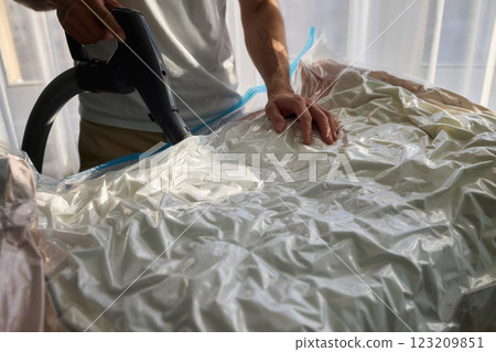 Vacuum Sealing Clothes Effectively for Storage, Preservation, and Space Saving Solutions Vacuum Sealing Clothes Effectively for Storage, Preservation, and Space Saving Solutions 123209851