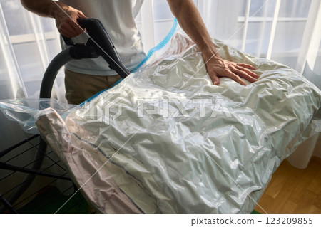 Vacuum Sealing Clothes Effectively for Storage, Preservation, and Space Saving Solutions Vacuum Sealing Clothes Effectively for Storage, Preservation, and Space Saving Solutions 123209855
