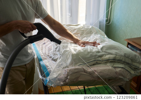 Vacuum Sealing Clothes Effectively for Storage, Preservation, and Space Saving Solutions Vacuum Sealing Clothes Effectively for Storage, Preservation, and Space Saving Solutions 123209861