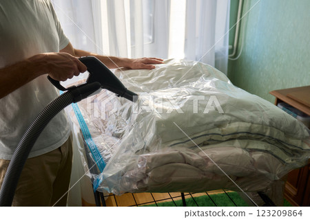 Vacuum Sealing Clothes Effectively for Storage, Preservation, and Space Saving Solutions Vacuum Sealing Clothes Effectively for Storage, Preservation, and Space Saving Solutions 123209864