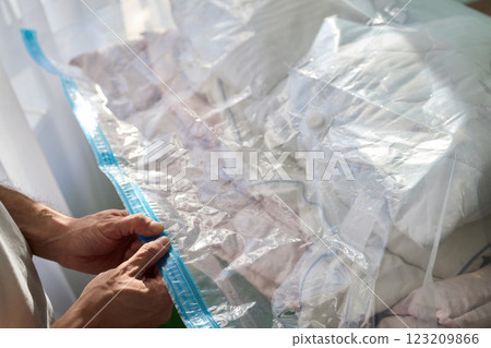 Vacuum Sealing Clothes Effectively for Storage, Preservation, and Space Saving Solutions Vacuum Sealing Clothes Effectively for Storage, Preservation, and Space Saving Solutions 123209866