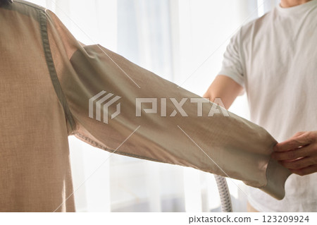 Steam cleaning your garments ensures a crisp, polished finish that enhances their appearance 123209924