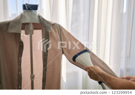 Steam cleaning your garments ensures a crisp, polished finish that enhances their appearance Steam cleaning your garments ensures a crisp, polished finish that enhances their appearance 123209954