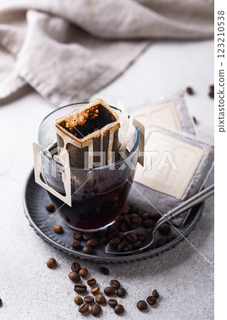 Freshly brewed drip coffee in glass cup Freshly brewed drip coffee in glass cup 123210538