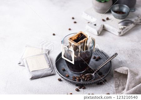 Freshly brewed drip coffee in glass cup 123210540