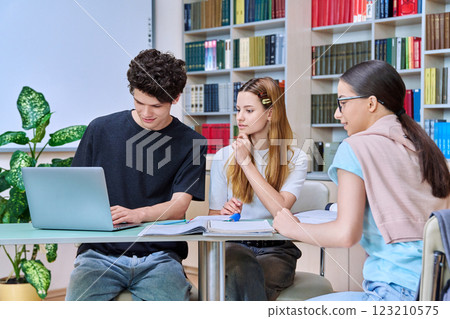 Group of college students are studying in library class Group of college students are studying in library class 123210575