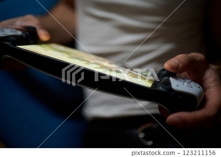 Enjoy an exciting gaming session with a handheld console full of thrills and adventures 123211156