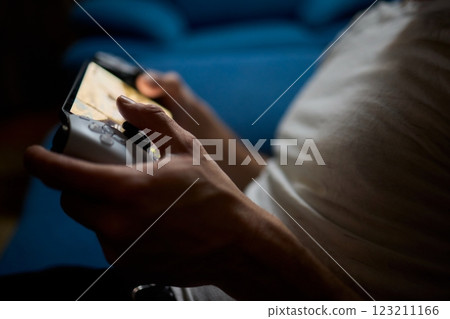 Enjoy an exciting gaming session with a handheld console full of thrills and adventures 123211166