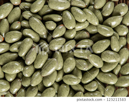 Candies with green chocolate glaze. Background, texture, lots of sweets. Candies with green chocolate glaze. Background, texture, lots of sweets. 123211583