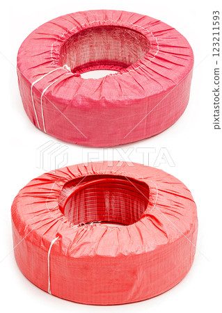 Red irrigation hose in a package. Isolated on a white background. 123211593