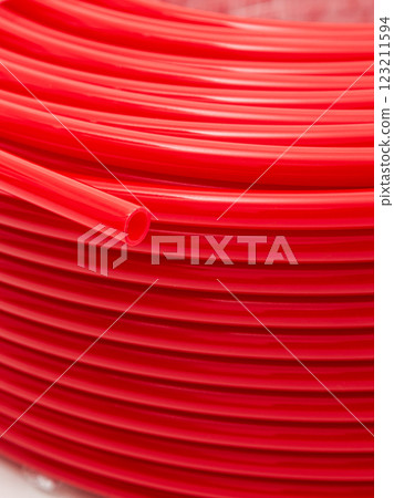 Red irrigation hose close-up. Background. Red irrigation hose close-up. Background. 123211594