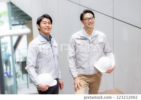 Staff of workers working in an office building Staff of workers working in an office building 123212002