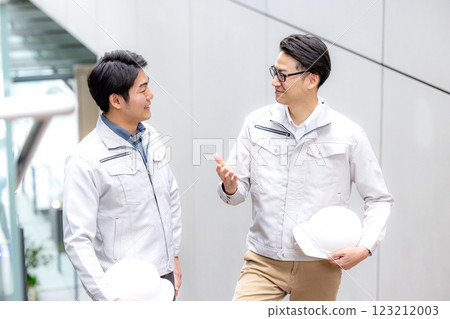 Staff of workers working in an office building Staff of workers working in an office building 123212003