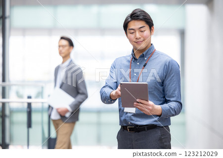 Image of a man working in an office lobby 123212029