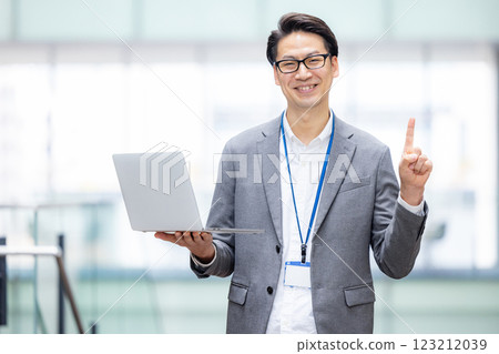 Male engineer working on a computer in an office 123212039