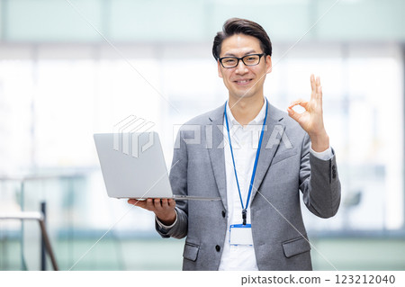 Male engineer working on a computer in an office 123212040