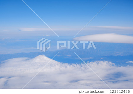 A view of the hanging clouds of Mt. Fuji from an airplane 123212436