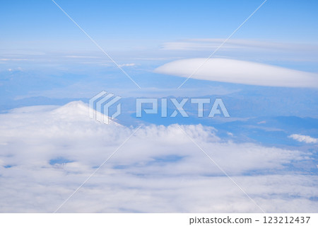 A view of the hanging clouds of Mt. Fuji from an airplane 123212437