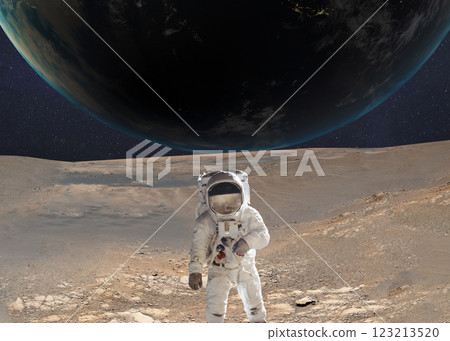 Astronaut on the surface of Mars with planet Earth in the background. 123213520