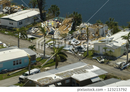 Destroyed by hurricane strong winds suburban houses in Florida mobile home residential area. Consequences of natural disaster 123213792