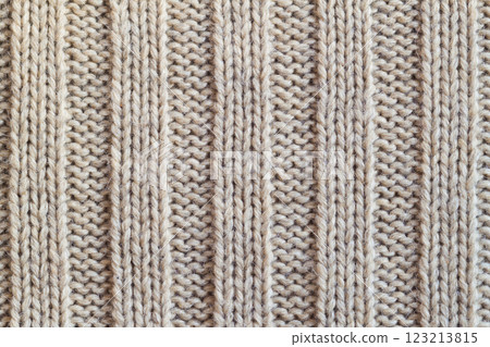 Creamy knitted wool warm clothes for the winter fabric texture background Creamy knitted wool warm clothes for the winter fabric texture background 123213815