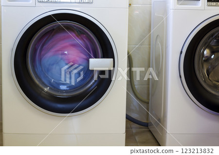 Colorful clothes and towels in washing machine 123213832