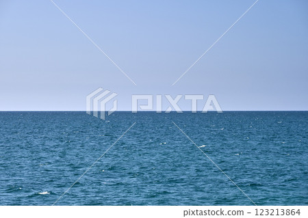 Closeup seascape surface of blue sea water with small ripple waves 123213864