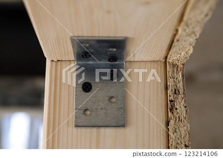 Close up detail of house construction wooden wall elements. Interior frame renovation work Close up detail of house construction wooden wall elements. Interior frame renovation work 123214106
