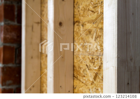 Close up detail of house construction wooden wall elements. Interior frame renovation work Close up detail of house construction wooden wall elements. Interior frame renovation work 123214108