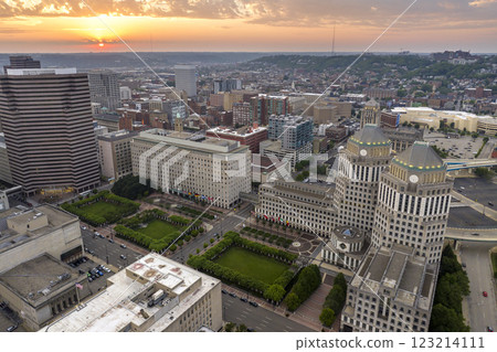 Cincinnati city, Ohio USA. View from above of brightly illuminated high skyscraper buildings in downtown district of American megapolis with business financial district at sunset 123214111