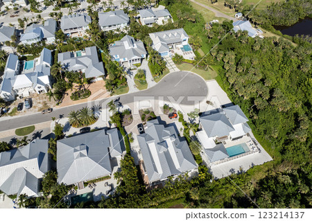 Boca Grande, Florida. Expensive waterfront houses between green palm trees. Premium housing development in the USA Boca Grande, Florida. Expensive waterfront houses between green palm trees. Premium housing development in the USA 123214137