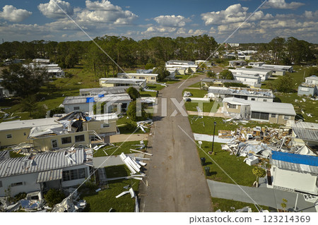 Badly damaged mobile homes after hurricane Ian in Florida residential area. Consequences of natural disaster Badly damaged mobile homes after hurricane Ian in Florida residential area. Consequences of natural disaster 123214369
