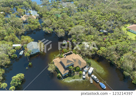 Aftermath of natural disaster. Surrounded by hurricane Ian rainfall flood waters homes in Florida residential area Aftermath of natural disaster. Surrounded by hurricane Ian rainfall flood waters homes in Florida residential area 123214397