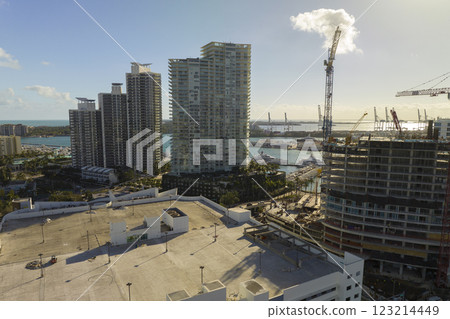Aerial view of new developing residense in american urban area. Tower cranes at industrial construction site in Miami, Florida. Concept of housing growth in the USA Aerial view of new developing residense in american urban area. Tower cranes at industrial construction site in Miami, Florida. Concept of housing growth in the USA 123214449
