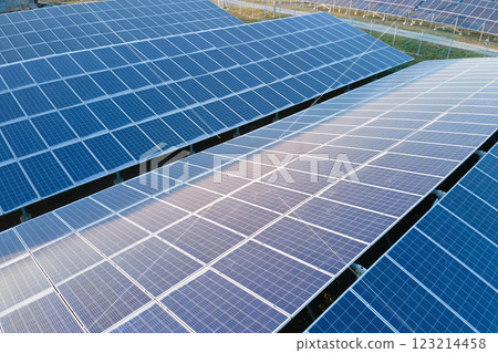 Aerial view of large sustainable electrical power plant with rows of solar photovoltaic panels for producing clean ecological electric energy. Renewable electricity with zero emission concept. 123214458