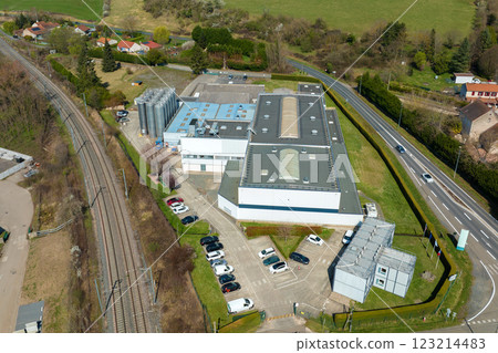 Aerial view of goods warehouses and logistics center in industrial city zone from above 123214483