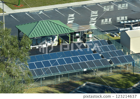 Aerial view of blue solar photovoltaic panels mounted on fenced backyard for producing clean ecological electric energy. Renewable electricity with zero emission concept 123214637