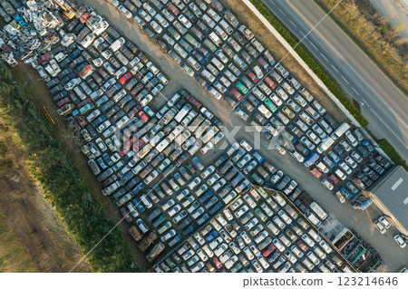 Aerial view of big parking lot of junkyard with rows of discarded broken cars. Recycling of old vehicles 123214646