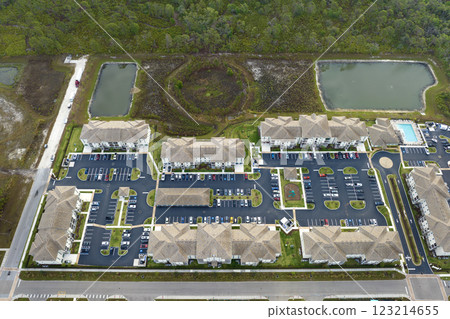 Aerial view of american apartment buildings in Florida residential area. New family condos as example of housing development in US suburbs 123214655