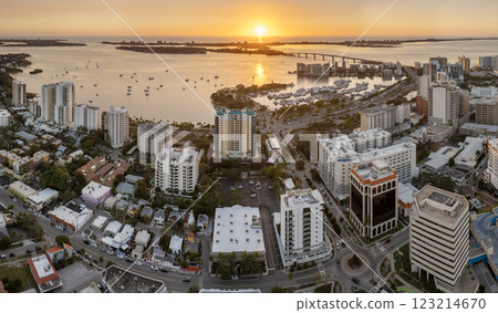 Above view of Sarasota city, Florida with yachts in bay harbor and waterfront office high-rise buildings. Development of housing and transportation in the US Above view of Sarasota city, Florida with yachts in bay harbor and waterfront office high-rise buildings. Development of housing and transportation in the US 123214670