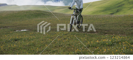 Riding mountain bike on beautiful mountain top 123214864