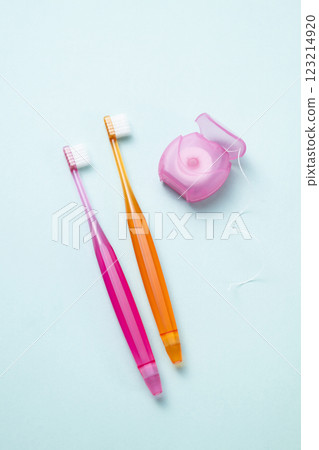 Dental floss and toothbrush 123214920