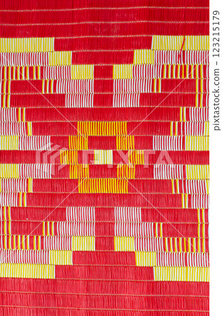 Vibrant textile pattern in red, yellow, and pink. 123215179