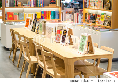 Cozy reading area with books and wooden furniture at Open House Co-Living Space at Central Embassy, Bangkok, Thailand Cozy reading area with books and wooden furniture at Open House Co-Living Space at Central Embassy, Bangkok, Thailand 123215214